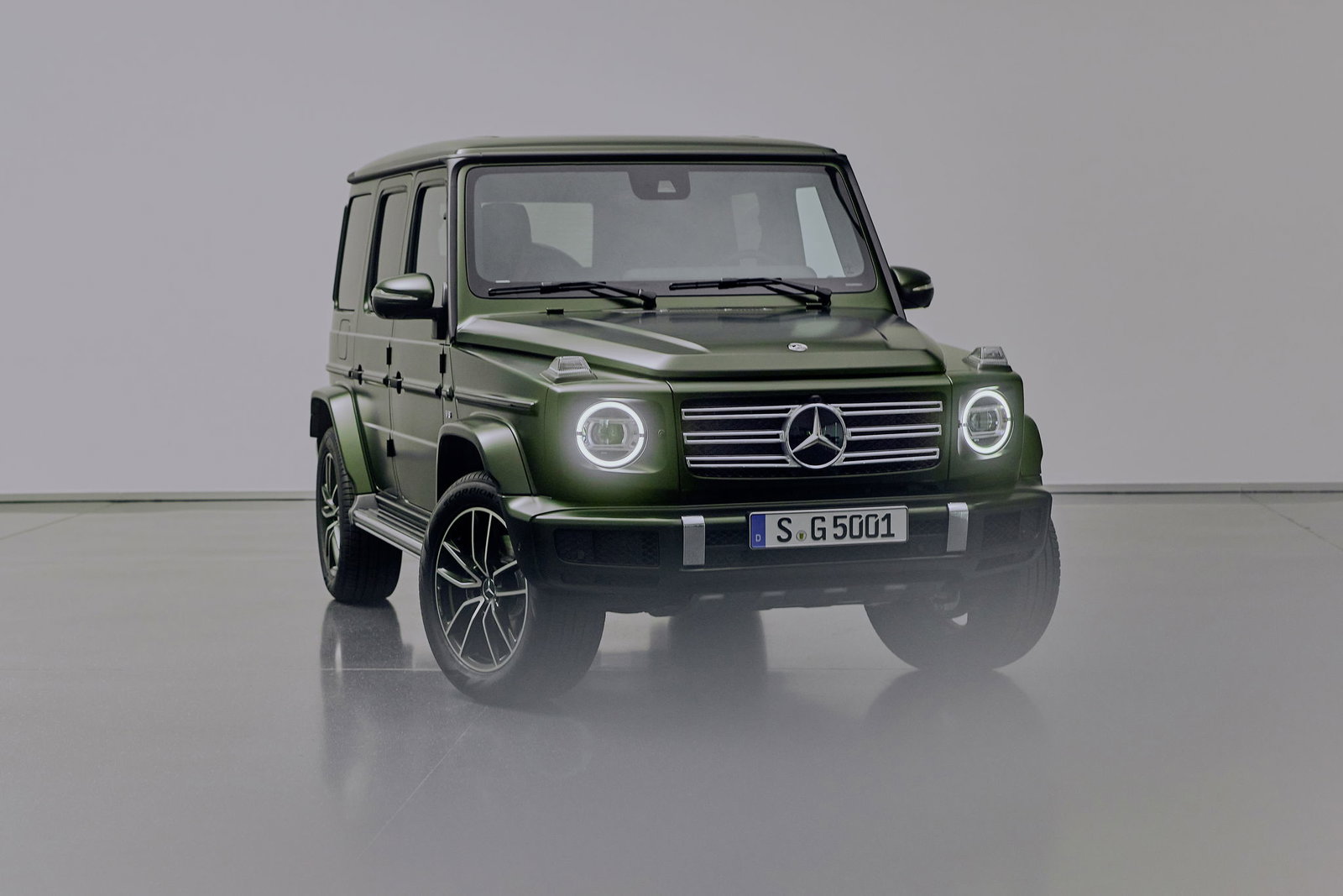 A green Mercedes-Benz G500 G-Class