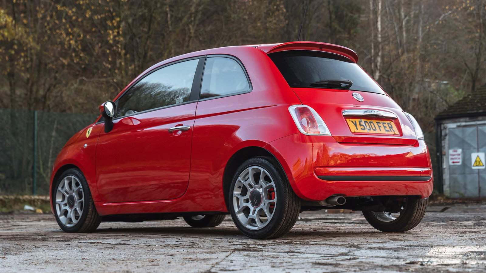It's Rosso Corsa, and has Scuderia shields. Basically the real thing, then