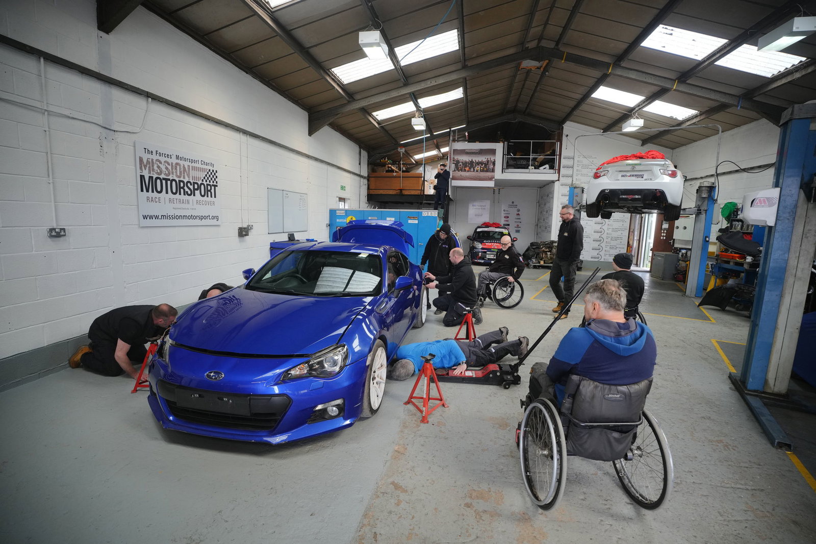 The Mission Motorsport team working on the BRZ