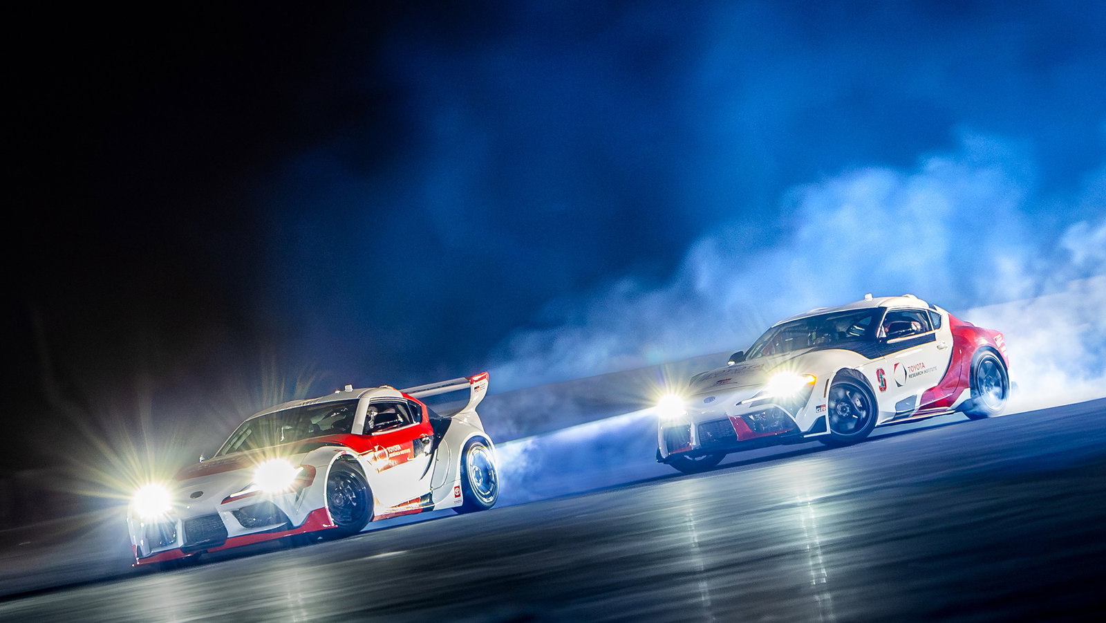 Two autonomous Toyota GR Supras drifting