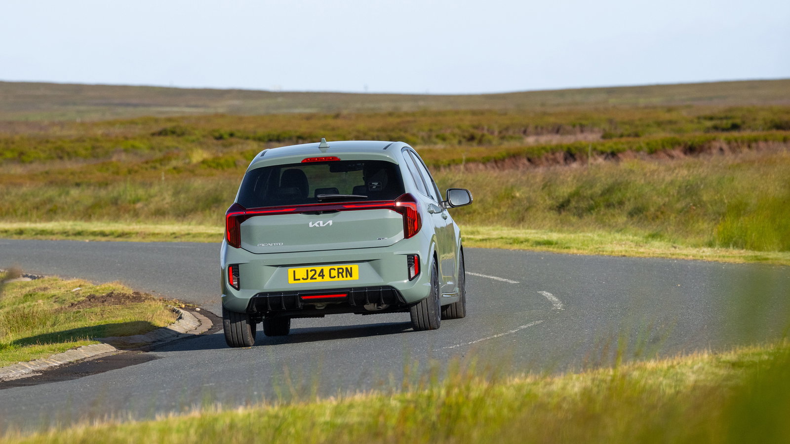 2024 Kia Picanto, rear 3/4, driving