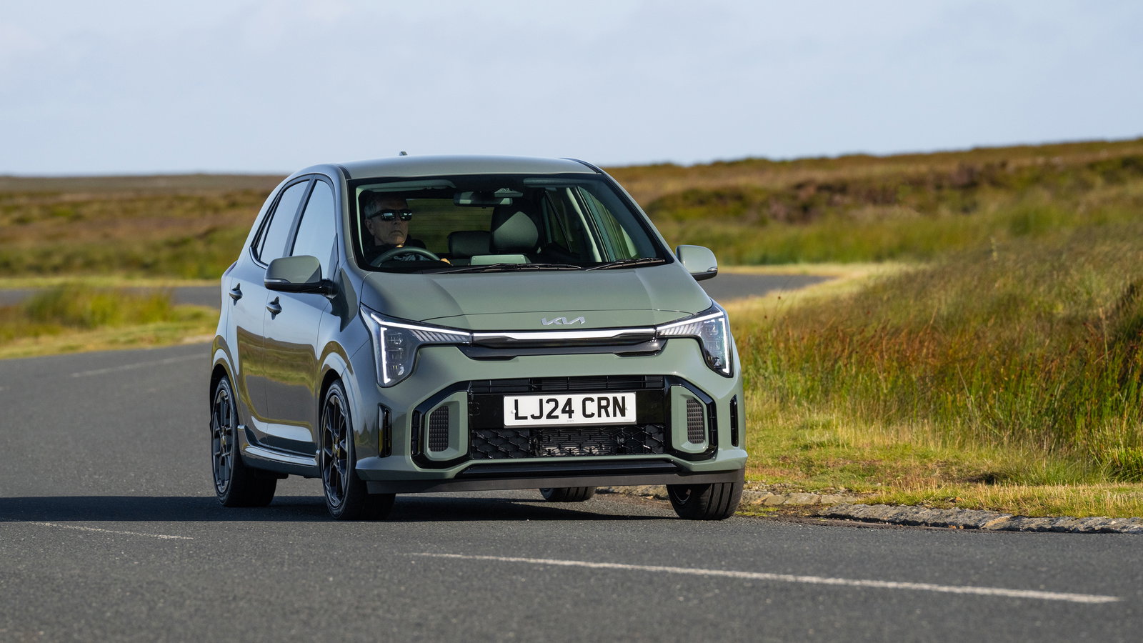 2024 Kia Picanto, front 3/4, driving