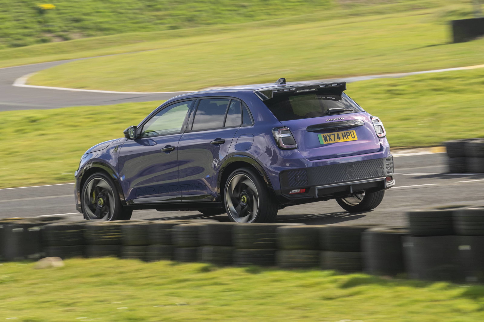 Abarth 600e - rear, driving