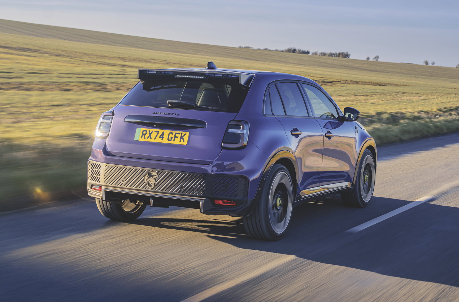 Abarth 600e - rear, driving