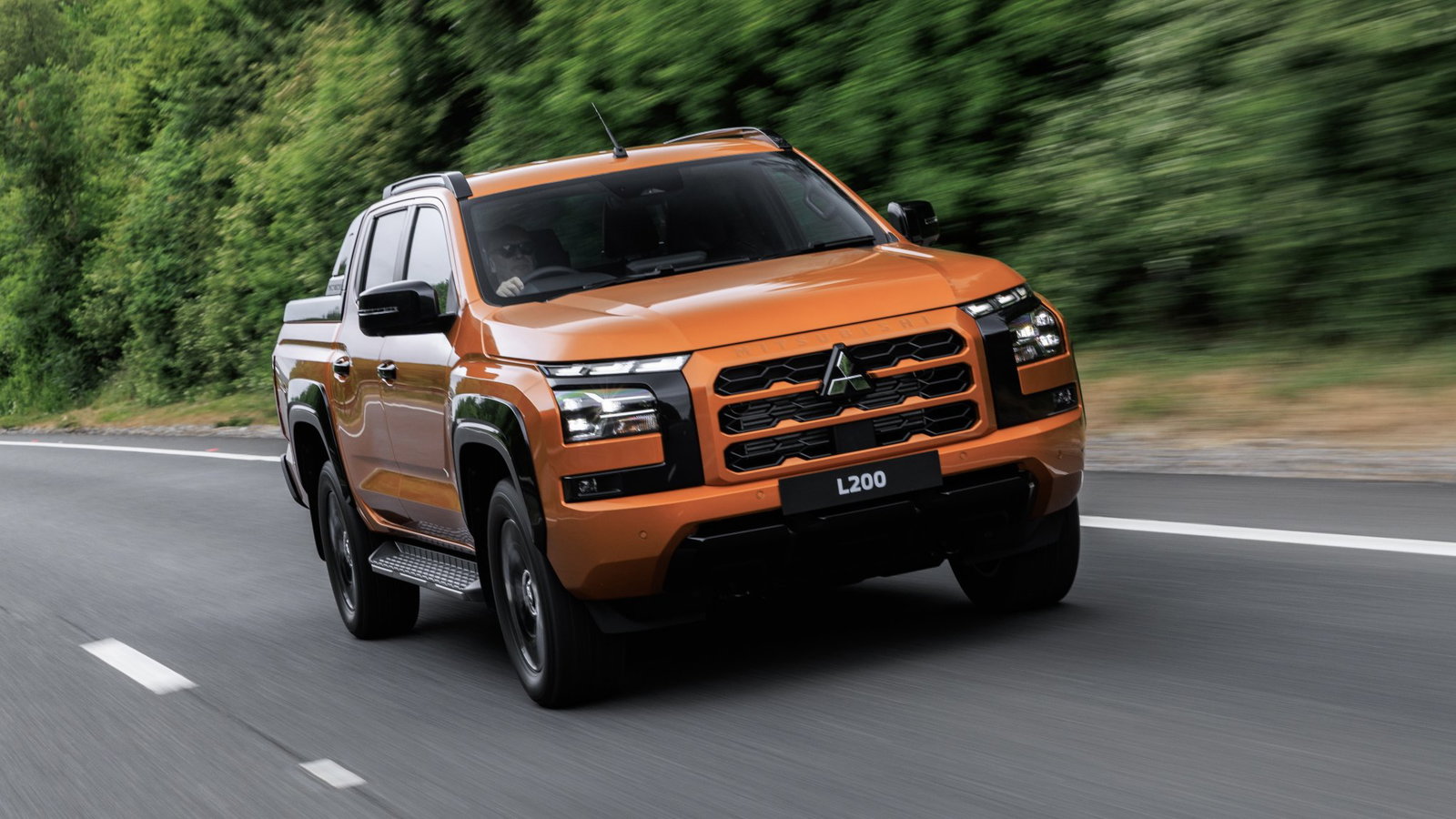2026 Mitsubishi L200 - front, driving