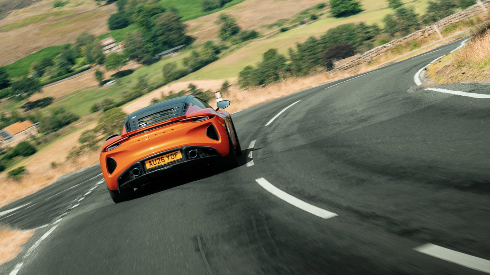 Lotus Emira 420 Sport - rear, driving