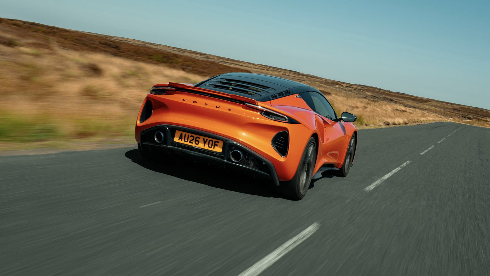 Lotus Emira 420 Sport - rear, driving