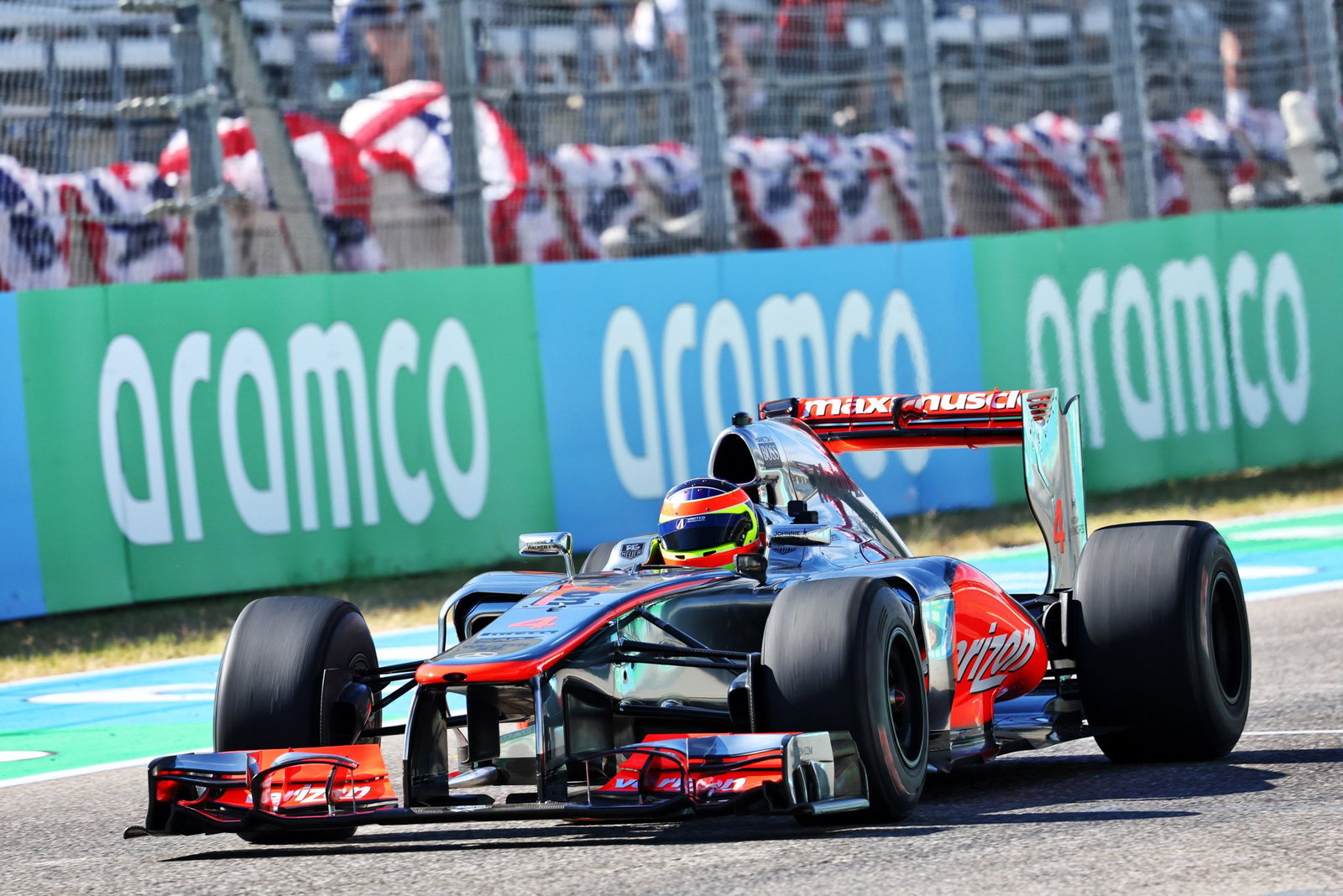 Jenson Button driving the iconic chrome McLaren in 2011