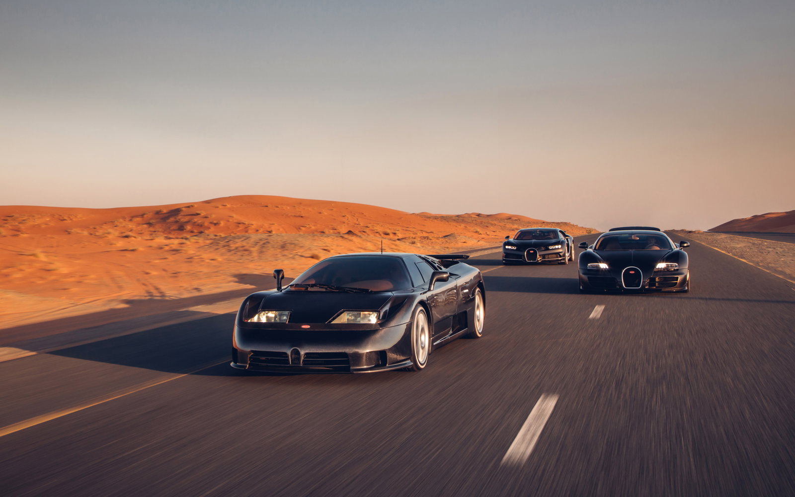 Three Generations Of Quad-Turbo Bugatti Come Together For Incredible Photocall