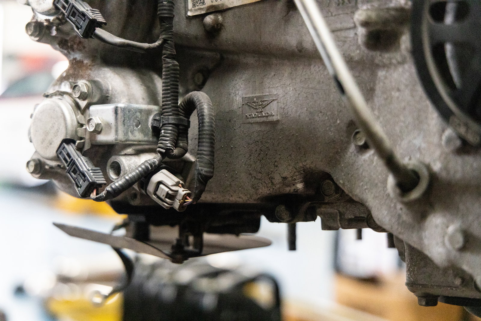 Note the oil escaping through the bottom left corner of the boxer engine's front cover