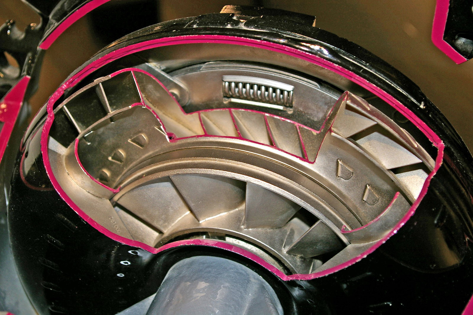 This cut-out shows the vanes of the centrifugal pump, along with a lockup clutch sandwiched in the middle and blocking the view of the turbine