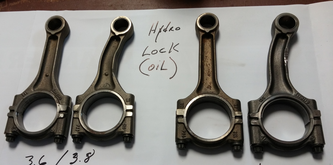 Some warped connecting rods bent by hydrolocking. Image via 996 Revolution