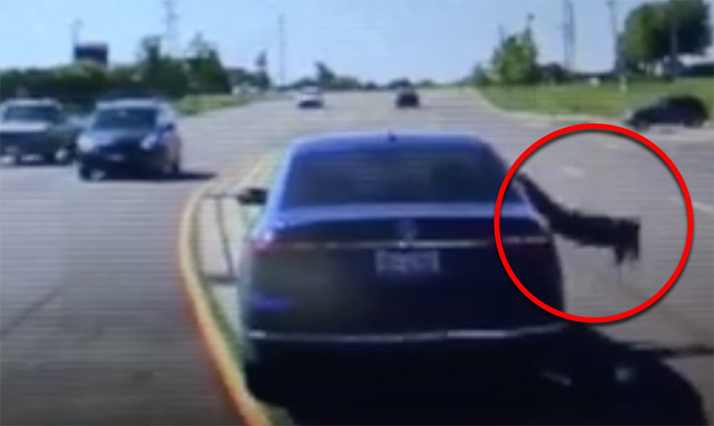 Watch The Moment A Brave Bystander Jumped Into A Moving Car To Stop An Accident