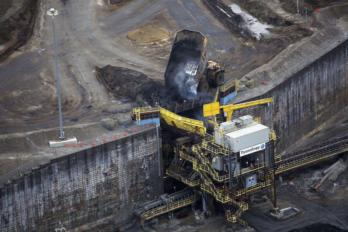 The extraction of oil sands in Alberta, Canada.