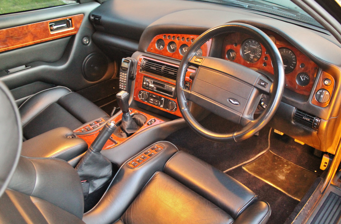 Wood, leather, a gear stick and an ancient car phone: what more do you need?