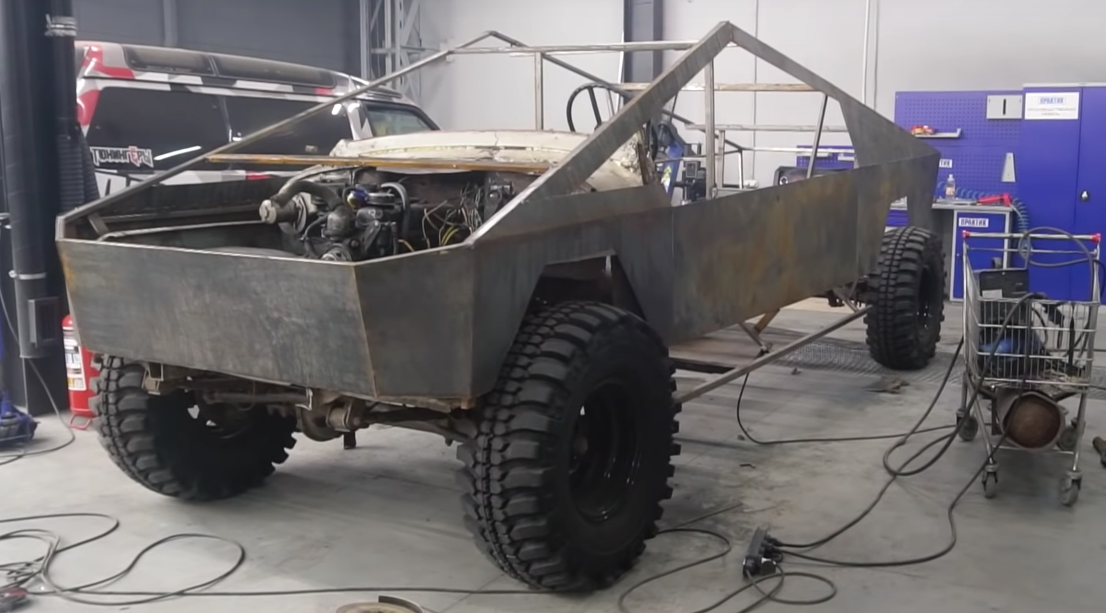 The replica Tesla CyberTruck has been fitted with a longer propshaft (Image via YouTube/Garage54)