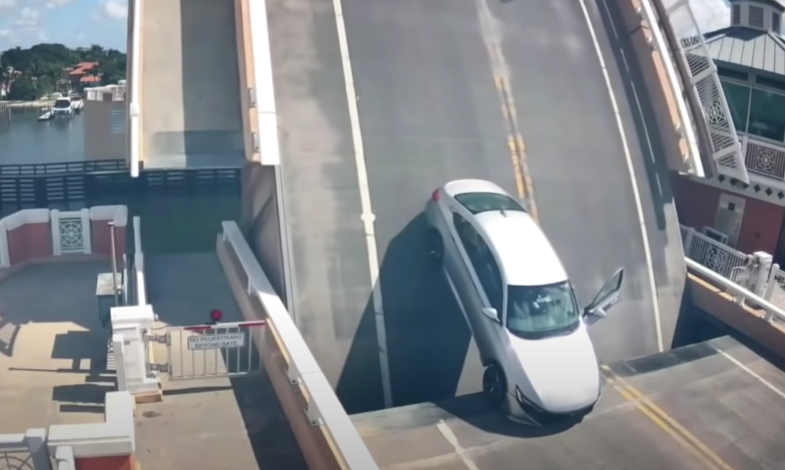 Watch As A Drawbridge Is Accidentally Raised With A Car Still On It