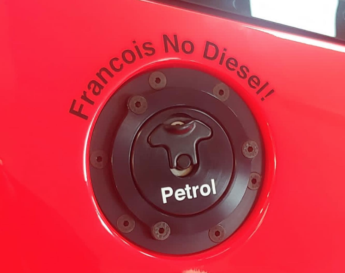 François's friends applied some much-needed stickers to the McLaren...